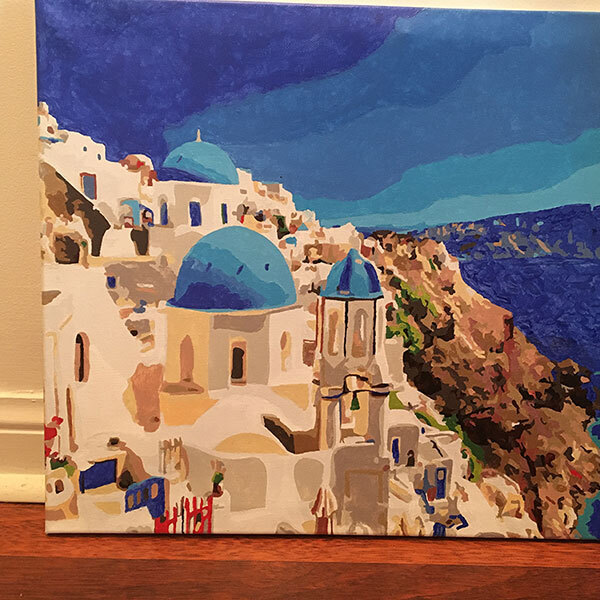 Completed paint by numbers of Greek seaside.