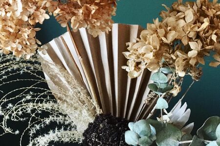 Paper fan and dried flowers.