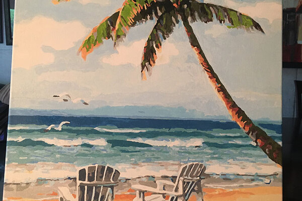Paint by numbers of two white deck chairs facing the ocean. Palm tree on the right.
