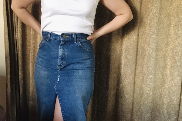 woman poses with denim skirt altered from jeans.