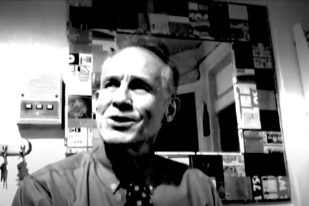 black and white photo of Broadway star Jim Walton performing in a theatre dressing room.