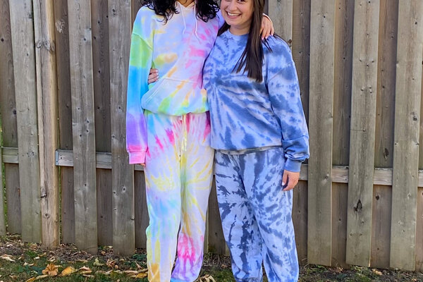  people wearing custom tie dyed clothing