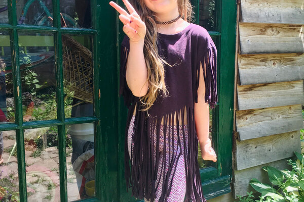 Little girl gives peace sign