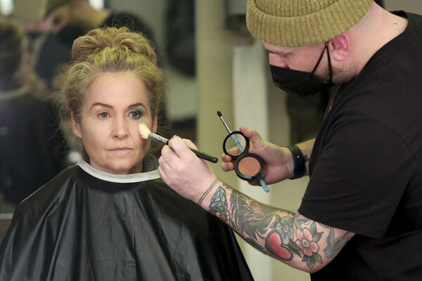 Makeup Designer Craig Forrest-Thomas applies a look on actor Raquel Duffy.